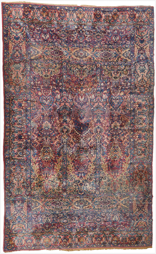 A Persian Kerman carpet