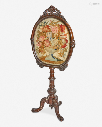 An English fire screen with floral petit point
