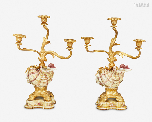 A pair of gilt-bronze and porcelain shell candlesticks