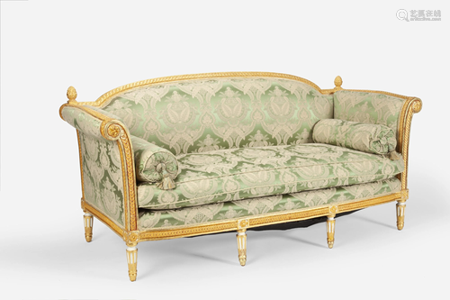 A French Louis XVI-style carved giltwood sofa