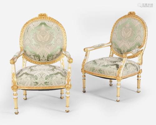 A pair of Louis XVI-style carved giltwood fauteuils