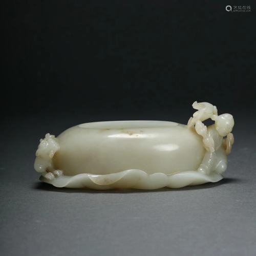A Carved Hetian White Jade Lotus Leaf with Child Brush