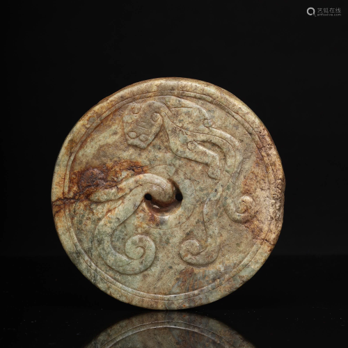 A Carved Jade Disc with Dragon Pattern
