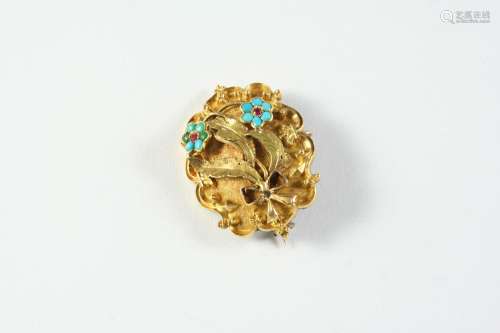 A VICTORIAN GOLD AND TURQUOISE BROOCH the gold mount of scro...