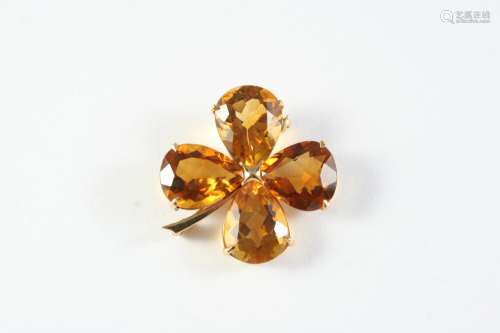 A CITRINE FOLIATE BROOCH formed with four pear-shaped citrin...