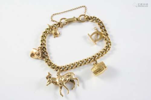 A 9CT GOLD CURB LINK BRACELET suspending five assorted charm...