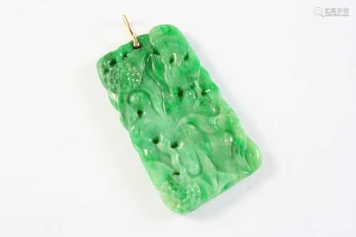 A JADE PENDANT of pierced and carved form, 5.5 x 3cm