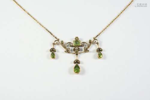 A PERIDOT AND DIAMOND NECKLACE the scrolling and foliate des...