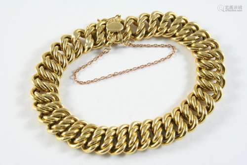 AN 18CT GOLD DOUBLE CURB LINK BRACELET with concealed clasp,...