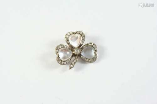 A VICTORIAN MOONSTONE AND DIAMOND SHAMROCK BROOCH formed wit...