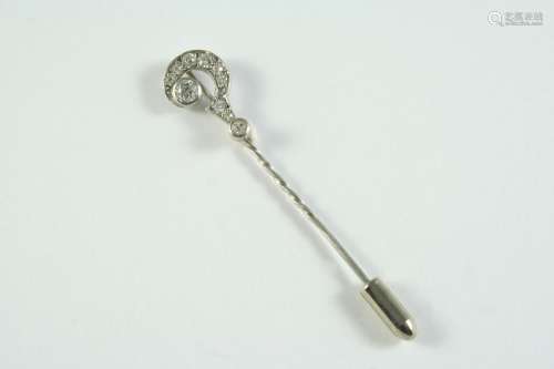A DIAMOND QUESTION MARK STICK PIN mounted with two collet se...