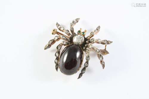 A VICTORIAN GARNET AND DIAMOND SPIDER BROOCH the body set wi...