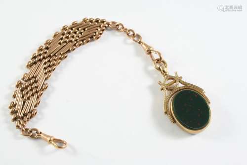 A BLOODSTONE AND BLACK ONYX SPINNING FOB in a 9ct gold mount...