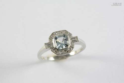 AN AQUAMARINE AND DIAMOND CLUSTER RING the octagonal-shaped ...