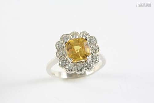 A YELLOW SAPPHIRE AND DIAMOND CLUSTER RING the cut cornered ...