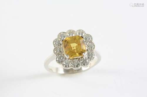 A YELLOW SAPPHIRE AND DIAMOND CLUSTER RING the cut cornered ...