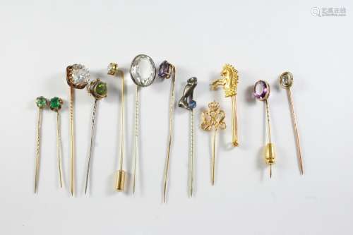 FORTY TWO ASSORTED STICK PINS a carved lava cameo stick pin,...