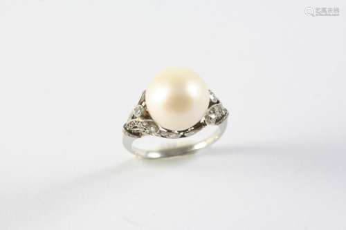 A CULTURED PEARL AND DIAMOND RING the cultured pearl measuri...