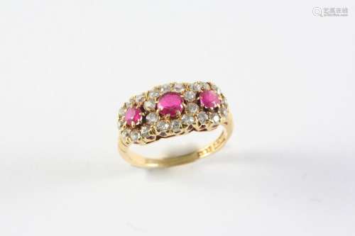 A RUBY AND DIAMOND TRIPLE CLUSTER RING the three circular-cu...
