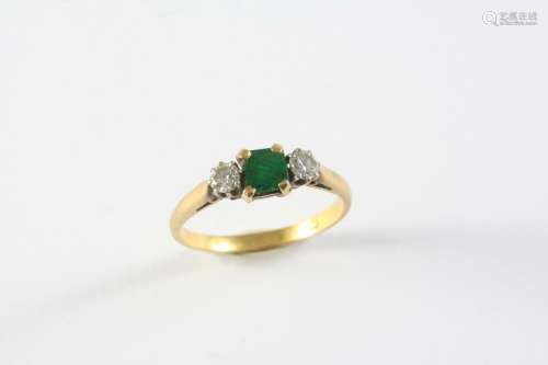 AN EMERALD AND DIAMOND THREE STONE RING the square-shaped em...