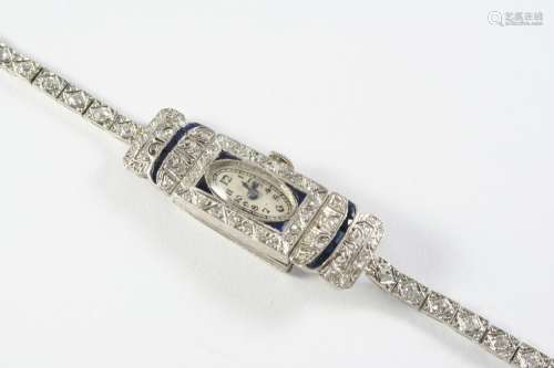 A LADY'S DIAMOND AND SAPPHIRE COCKTAIL WRISTWATCH the oval-s...