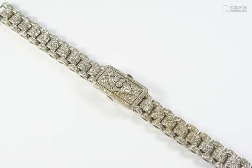 AN ART DECO LADY'S DIAMOND COCKTAIL WRISTWATCH millegrain se...