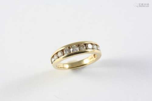 A DIAMOND HALF HOOP RING the yellow gold band is mounted wit...