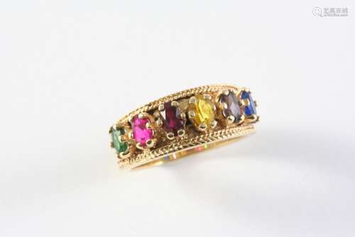 A GOLD AND GEM SET RING the gold band with embossed decorati...