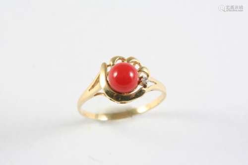 A CORAL, DIAMOND AND GOLD RING the coral cabochon set with a...