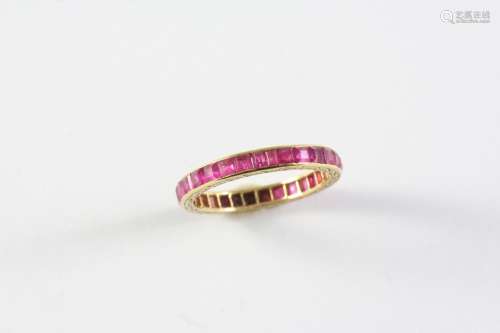 A RUBY FULL CIRCLE ETERNITY RING set with calibre-cut rubies...