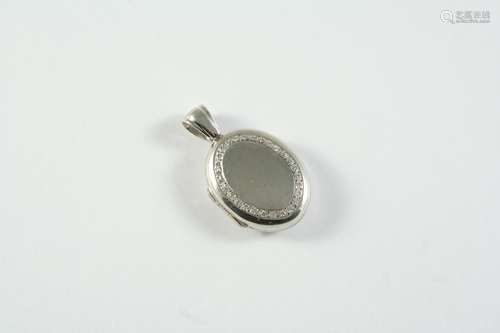 A DIAMOND AND 18CT WHITE GOLD LOCKET PENDANT the oval-shaped...