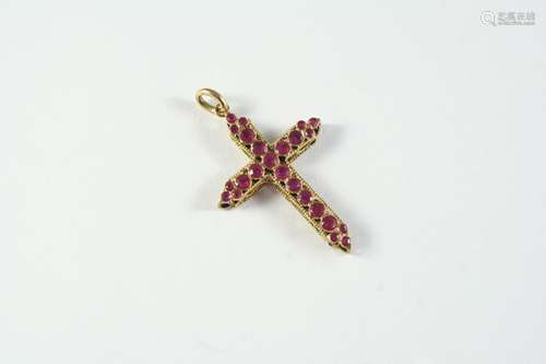 A SAPPHIRE, RUBY AND GOLD CRUCIFORM PENDANT the gold openwor...