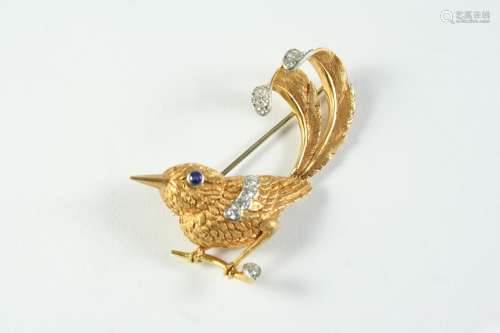 A GOLD AND DIAMOND STYLISED WREN BROOCH mounted with circula...