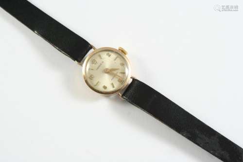 A LADY'S GOLD WRISTWATCH BY ROLEX the signed circular dial w...