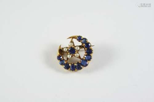 A SAPPHIRE AND PEARL CLOSED CRESCENT AND STAR BROOCH mounted...