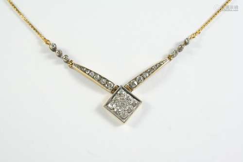 A DIAMOND AND GOLD NECKLACE the 18ct gold fine link chain is...