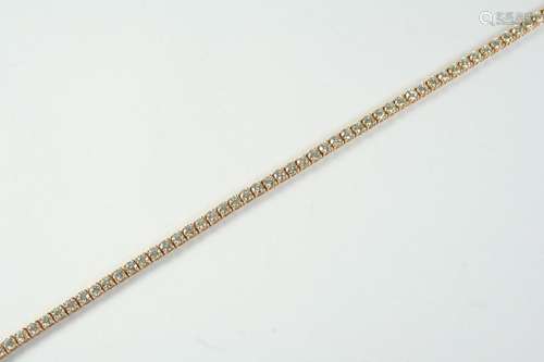 A DIAMOND LINE BRACELET mounted with fifty eight circular-cu...