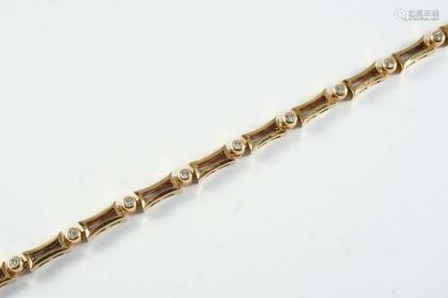 A DIAMOND AND GOLD BRACELET formed alternately with circular...