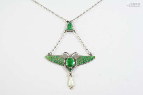 AN ART NOUVEAU ENAMEL AND SILVER SCARAB PENDANT BY CHARLES H...