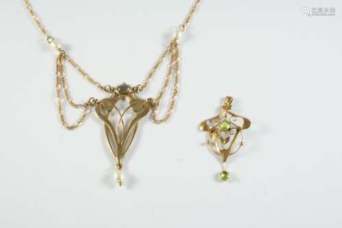 AN ART NOUVEAU GOLD AND PEARL SET PENDANT the foliate openwo...