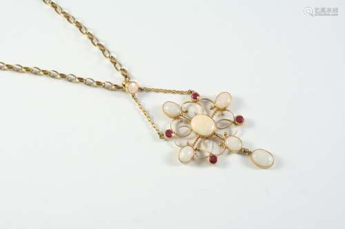 AN OPAL AND RUBY PENDANT the gold openwork quatrefoil mount ...