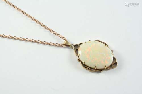 A WHITE OPAL AND GOLD PENDANT the oval-shaped solid white op...