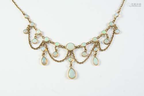AN OPAL AND GOLD DROP NECKLACE the gold chain mounted with g...