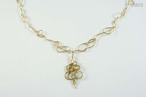 A GOLD AND DIAMOND PENDANT the 18ct gold abstract openwork n...