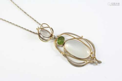 A MOONSTONE AND PERIDOT PENDANT the silver openwork mount is...