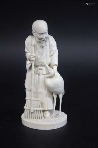 IVORY OKIMONO OF AN ELDERLY MAN & CRANE - SIGNED, a Meiji pe...