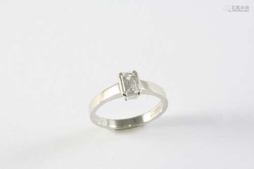 A DIAMOND SOLITAIRE RING set with an emerald-cut diamond in ...
