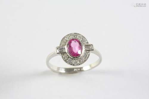 A PINK SAPPHIRE AND DIAMOND CLUSTER RING the oval-shaped pin...