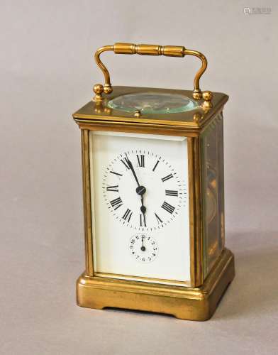 A BRASS CASED CARRIAGE CLOCK WITH ALARM, with a rectangular ...