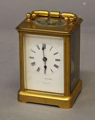 A GILT BRASS CASED CARRIAGE CLOCK, with a white enamelled di...
